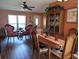 Bright dining area with wooden table and hutch at 4415 Great Lakes N Dr, Clearwater, FL 33762