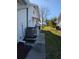 Side of the house with AC unit and landscaping at 4415 Great Lakes N Dr, Clearwater, FL 33762