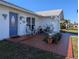 Inviting front porch with tiled flooring and seating area at 4415 Great Lakes N Dr, Clearwater, FL 33762