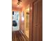 Bright hallway with wood floors and access to other rooms at 4415 Great Lakes N Dr, Clearwater, FL 33762