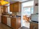 Bright kitchen with wood cabinets and appliances at 4415 Great Lakes N Dr, Clearwater, FL 33762