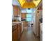 Bright kitchen with wood cabinets and tiled floor at 4415 Great Lakes N Dr, Clearwater, FL 33762