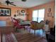 Spacious living room with hardwood floors and comfy seating at 4415 Great Lakes N Dr, Clearwater, FL 33762