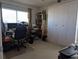 Spacious home office with large window and built-in shelving at 4415 Great Lakes N Dr, Clearwater, FL 33762
