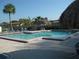 Community swimming pool with lounge chairs at 4415 Great Lakes N Dr, Clearwater, FL 33762