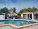 Inviting community pool with shaded seating area at 4415 Great Lakes N Dr, Clearwater, FL 33762
