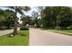 Neighborhood entrance with lush landscaping and signage at 4415 Great Lakes N Dr, Clearwater, FL 33762