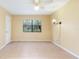 Bright bedroom with tiled floors and a window view at 4910 Bay Ne St # 109, St Petersburg, FL 33703