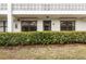 Building exterior featuring unit entrance and landscaping at 4910 Bay Ne St # 109, St Petersburg, FL 33703