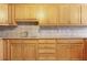 Oak cabinets and granite countertops in this kitchen at 4910 Bay Ne St # 109, St Petersburg, FL 33703