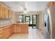 Kitchen with oak cabinets, granite counters, and stainless steel appliances at 4910 Bay Ne St # 109, St Petersburg, FL 33703