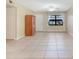 Large living area with tile floors and two ceiling fans at 4910 Bay Ne St # 109, St Petersburg, FL 33703