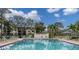 Refreshing community pool with lounge chairs and patio area at 4910 Bay Ne St # 109, St Petersburg, FL 33703