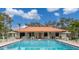 Inviting pool area with covered patio and seating at 4910 Bay Ne St # 109, St Petersburg, FL 33703