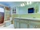 Bathroom with double vanity and shower/tub combo at 712 Bowsprit Pl, Palm Harbor, FL 34685