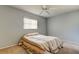 Bedroom with ceiling fan and striped bedding at 712 Bowsprit Pl, Palm Harbor, FL 34685