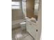 Bathroom with tub, toilet, and white vanity at 7323 Belvedere Ter, New Port Richey, FL 34655