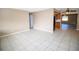 Spacious living room featuring tile flooring and a ceiling fan at 7323 Belvedere Ter, New Port Richey, FL 34655