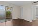 Spacious bedroom with sliding glass doors to a private balcony at 90 S Highland Ave # 102, Tarpon Springs, FL 34689