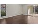 Bedroom with sliding glass doors to a private balcony at 90 S Highland Ave # 102, Tarpon Springs, FL 34689