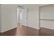 Bedroom with built-in shelving and access to hallway at 90 S Highland Ave # 102, Tarpon Springs, FL 34689