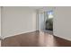 Bright bedroom with sliding doors to a private balcony at 90 S Highland Ave # 102, Tarpon Springs, FL 34689
