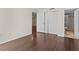 Bright bedroom with wood-look floors and ample closet space at 90 S Highland Ave # 102, Tarpon Springs, FL 34689
