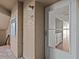 Condo entry with white door and view into kitchen at 90 S Highland Ave # 102, Tarpon Springs, FL 34689