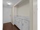 Condo entry with white cabinets and wood flooring at 90 S Highland Ave # 102, Tarpon Springs, FL 34689