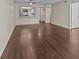 Spacious living room with wood-look flooring and kitchen passthrough at 90 S Highland Ave # 102, Tarpon Springs, FL 34689