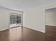 Living room with sliding doors leading to a balcony at 90 S Highland Ave # 102, Tarpon Springs, FL 34689