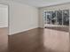 Bright living room with sliding glass doors to a screened balcony at 90 S Highland Ave # 102, Tarpon Springs, FL 34689