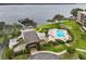 Community pool, clubhouse, and waterfront views at 90 S Highland Ave # 102, Tarpon Springs, FL 34689