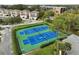 Aerial view of two well-maintained tennis courts at 90 S Highland Ave # 102, Tarpon Springs, FL 34689