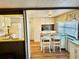 Eat-in kitchen with wood-look flooring and a breakfast bar at 9790 66Th N St # 312, Pinellas Park, FL 33782