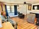 Living room with comfortable seating and wood-look flooring at 9790 66Th N St # 312, Pinellas Park, FL 33782