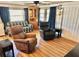 Spacious living room with wood-look floors and comfy seating at 9790 66Th N St # 312, Pinellas Park, FL 33782
