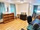 Bright home office featuring hardwood floors and ample shelving at 9790 66Th N St # 312, Pinellas Park, FL 33782