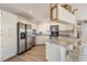 Modern kitchen with stainless steel appliances and granite countertops at 1029 Falcon Ridge Ln, Palm Harbor, FL 34683