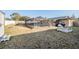 Large backyard with shed, fire pit, and screened pool at 11201 Mercedes St, Spring Hill, FL 34609