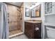 Bathroom with updated vanity, shower, and tile at 11201 Mercedes St, Spring Hill, FL 34609