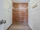 Large closet with wire shelving and wood paneling at 11201 Mercedes St, Spring Hill, FL 34609