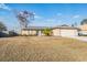 Single-story house with attached garage and landscaped yard at 11201 Mercedes St, Spring Hill, FL 34609