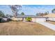 Single-story house with attached garage and fenced yard at 11201 Mercedes St, Spring Hill, FL 34609