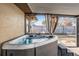 Relaxing hot tub located on patio with privacy curtains at 11201 Mercedes St, Spring Hill, FL 34609