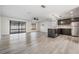 Open kitchen with dark cabinetry and island at 11201 Mercedes St, Spring Hill, FL 34609