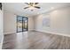 Living room with sliding glass doors leading to the patio at 11201 Mercedes St, Spring Hill, FL 34609