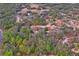 Aerial view of property showing house, detached garage, and surrounding land at 12404 Dolquieb Ln, Weeki Wachee, FL 34614