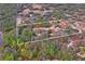Aerial view of a home on a spacious lot with mature trees and a pool at 12404 Dolquieb Ln, Weeki Wachee, FL 34614