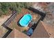 Aerial view of above ground pool and house at 12404 Dolquieb Ln, Weeki Wachee, FL 34614